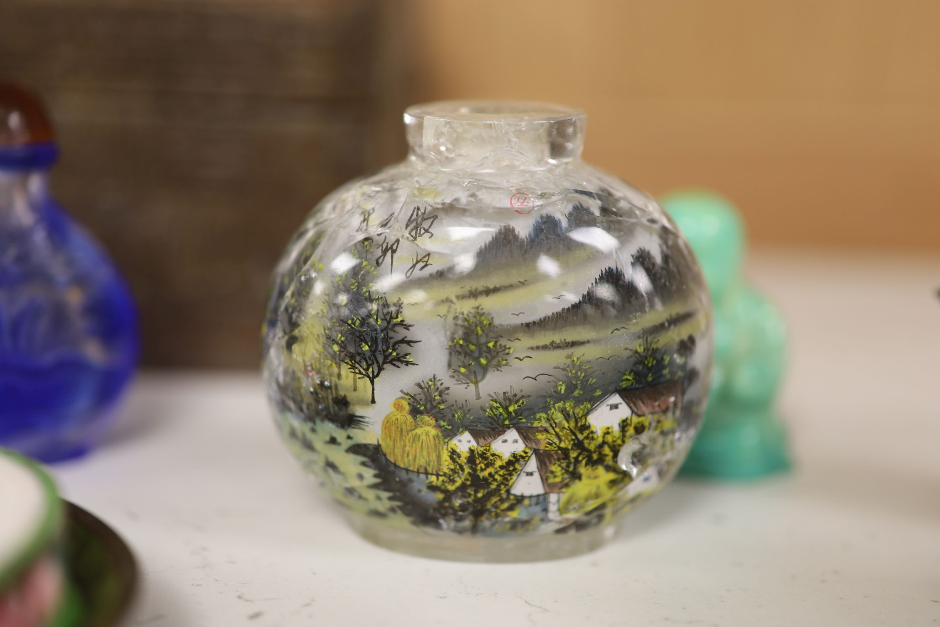 A small miscellaneous Oriental collection including enamel snuff boxes, Buddha carvings etc.